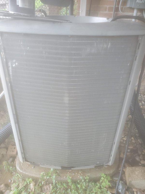 Completed routine cooling season maintenance on residential air conditioning system. Inspected outdoor condensing unit with protective screen cover, verified proper airflow and clearance around equipment, and checked refrigerant lines and electrical connections. Examined indoor condensate drain pan in attic space, confirmed condensate pump operation with adequate water removal, and verified safety float switch functionality to prevent overflow conditions.