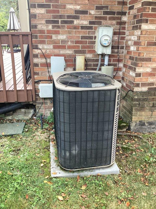 Provided estimate for complete HVAC system replacement including non-operational outdoor air conditioning condenser unit (20+ years old) located on exterior concrete pad and indoor furnace cabinet installed in basement utility area. Assessed existing equipment configuration including copper refrigerant lines, PVC condensate drainage, electrical connections, and natural gas supply lines to determine replacement specifications and installation requirements.