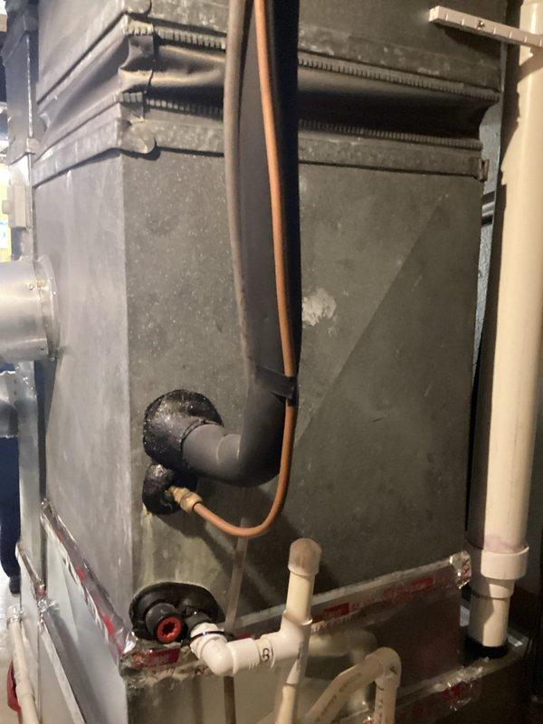Provided estimate for complete HVAC system replacement including non-operational outdoor air conditioning condenser unit (20+ years old) located on exterior concrete pad and indoor furnace cabinet installed in basement utility area. Assessed existing equipment configuration including copper refrigerant lines, PVC condensate drainage, electrical connections, and natural gas supply lines to determine replacement specifications and installation requirements.