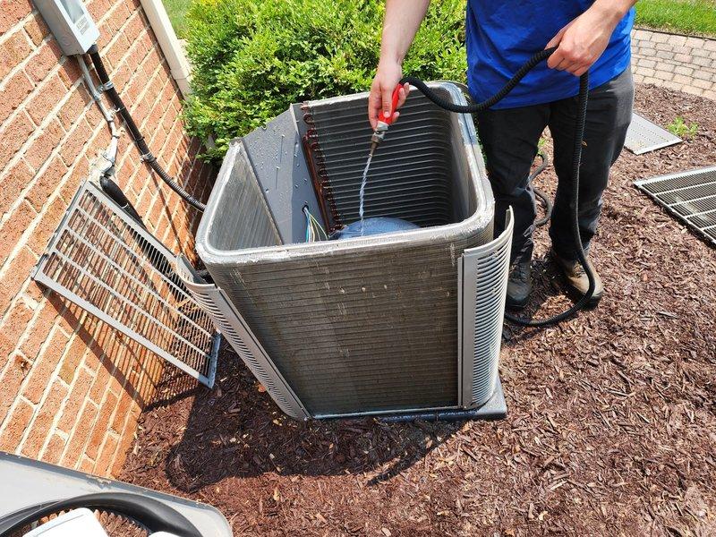 Performed comprehensive cooling season maintenance on outdoor condensing unit per Worry Free Service Agreement. Inspected heat exchanger coils, which showed significant accumulation of dirt and debris with visible discoloration across fin surfaces. Accessed compressor compartment, evaluated electrical connections and refrigerant lines, and assessed overall system operation. Unit demonstrated weathering consistent with extended outdoor exposure, requiring attention to maintain optimal heat transfer efficiency and system performance.