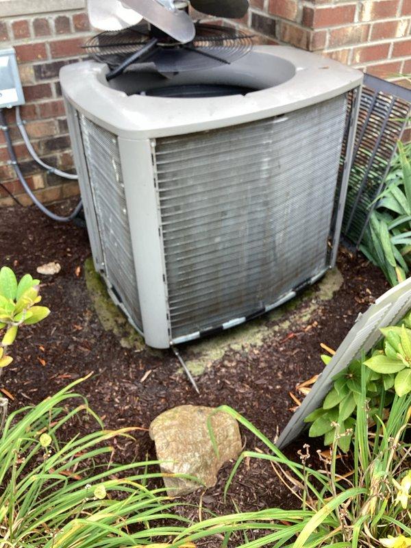 Responded to service call for water leaking from under furnace. Upon inspection, identified condensate drainage issue and addressed the problem. Documented equipment condition with photos showing interior components of outdoor condensing unit, including compressor, evaporator coils with visible dust accumulation, and base plate with some corrosion present. Customer advised to schedule air conditioning maintenance service for comprehensive system evaluation and cleaning.