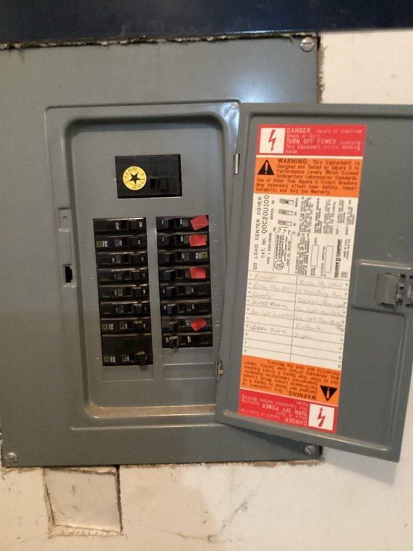 Conducted comprehensive on-site evaluation for complete HVAC system replacement. Assessed existing outdoor condensing unit and indoor electrical service panel, documented current equipment specifications, refrigerant line routing, and electrical disconnect configuration. Photographed all relevant components including breaker panel layout with circuit directory, existing condenser unit with copper line set penetration point, and concrete pad placement to provide detailed replacement estimate and system design recommendations.