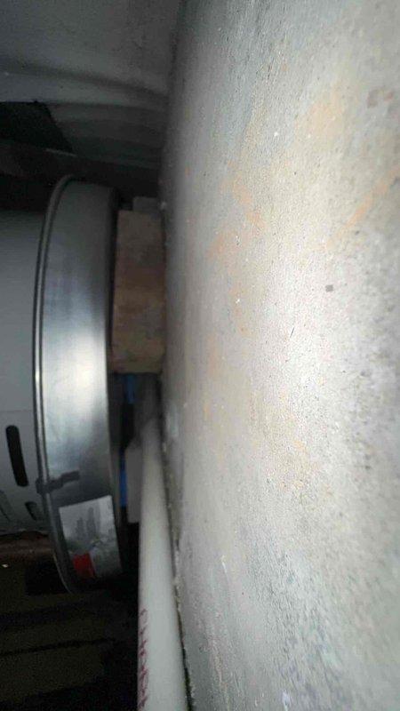 Completed warranty inspection corrections on water heater installation. Replaced non-compliant PVC drain pan piping with approved water distribution materials per Table 605.4 specifications. Stabilized water heater base by installing additional support shims to ensure proper level and manufacturer-recommended clearances, bringing installation into full code compliance.
