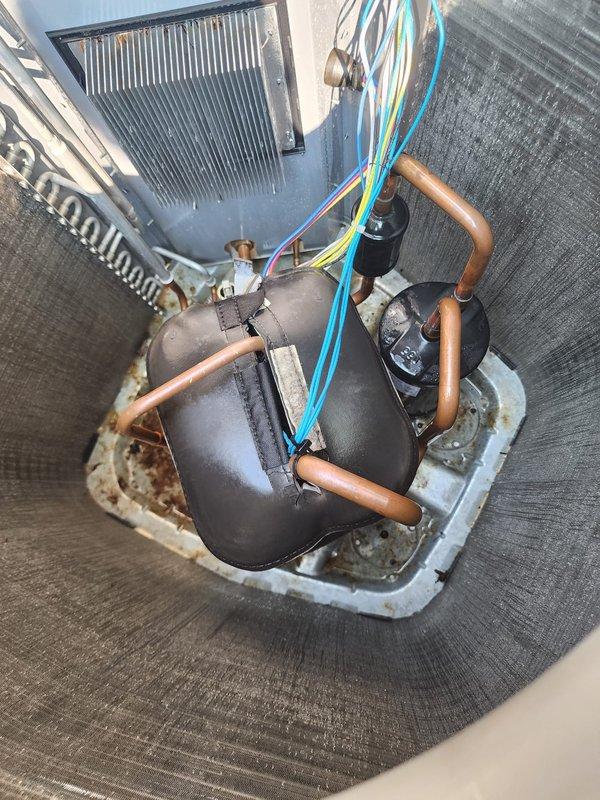 Completed routine cooling season maintenance on residential split system air conditioning unit and hot water tank inspection. Performed comprehensive maintenance on outdoor condenser unit including coil inspection, electrical connection verification, and operational testing. Inspected indoor evaporator coil assembly, compressor unit, refrigerant lines, condensate drain pan for proper drainage and potential overflow issues, and verified all electrical connections secure. All components found operating within normal parameters with no immediate service needs identified.