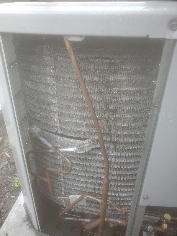 Completed preventive maintenance inspection on residential cooling system under Worry Free Service Agreement. Inspected evaporator coil assembly, verified proper refrigerant line connections, and examined blower compartment with motor assembly. All components found to be operating within normal parameters with copper refrigerant lines and electrical connections secure.