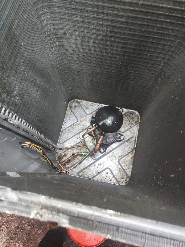 Completed routine AC maintenance on residential split system following power restoration. Performed comprehensive inspection of indoor air handler unit, documenting internal blower compartment condition with accumulated dust and debris on heat exchanger surfaces and housing. Inspected motor assembly, copper refrigerant lines, and electrical connections for proper operation. Evaluated outdoor condensing unit positioned on concrete pad, verified condenser coil fins are clean and undamaged, and confirmed unit is operating within normal parameters.