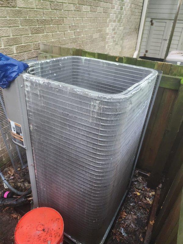 Completed routine AC maintenance on residential split system following power restoration. Performed comprehensive inspection of indoor air handler unit, documenting internal blower compartment condition with accumulated dust and debris on heat exchanger surfaces and housing. Inspected motor assembly, copper refrigerant lines, and electrical connections for proper operation. Evaluated outdoor condensing unit positioned on concrete pad, verified condenser coil fins are clean and undamaged, and confirmed unit is operating within normal parameters.