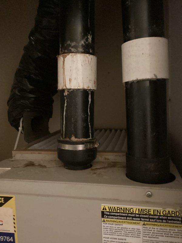 Conducted comprehensive evaluation of existing HVAC system for air conditioning replacement estimate. Customer requested AC-only replacement due to budget constraints. Documented current outdoor condenser unit showing significant age and weathering, with visible deterioration of housing and components. Unit positioned on plastic equipment pad against exterior wall with proper electrical disconnect and conduit installation. Interior inspection revealed aging ductwork with deteriorated tape and insulation, evidence of corrosion on pipe connections, and worn hose clamps requiring attention. Photographed all equipment conditions to support replacement recommendations. Provided estimate for new air conditioning system installation to address cooling needs within specified budget parameters.