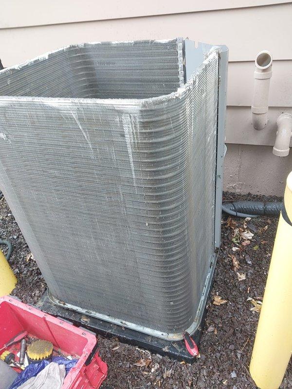 Completed comprehensive cooling season maintenance on residential air conditioning system. Performed thorough inspection of outdoor condenser unit including coil condition assessment, compressor operation verification, electrical connection examination, and drain pan evaluation. Unit operational with normal wear patterns observed; all components functioning within manufacturer specifications at time of service.