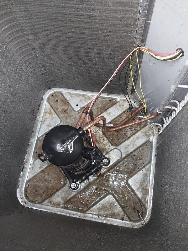 Completed comprehensive cooling season maintenance on residential air conditioning system. Performed thorough inspection of outdoor condenser unit including coil condition assessment, compressor operation verification, electrical connection examination, and drain pan evaluation. Unit operational with normal wear patterns observed; all components functioning within manufacturer specifications at time of service.
