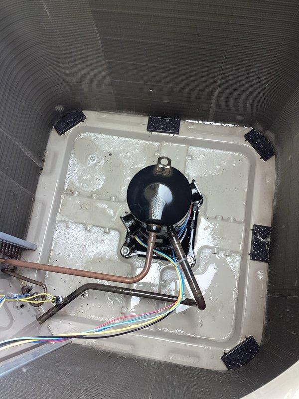 Completed scheduled cooling system maintenance under Worry Free Service Agreement. Performed comprehensive inspection of air handler components including condensate drain pan, compressor unit, refrigerant lines, and electrical connections. Drain pan showed normal condensation accumulation with minor debris present. Verified proper operation of compressor mounted on vibration dampening pads, inspected copper refrigerant lines and wiring harness for secure connections and proper routing. All components functioning within normal parameters at time of inspection.