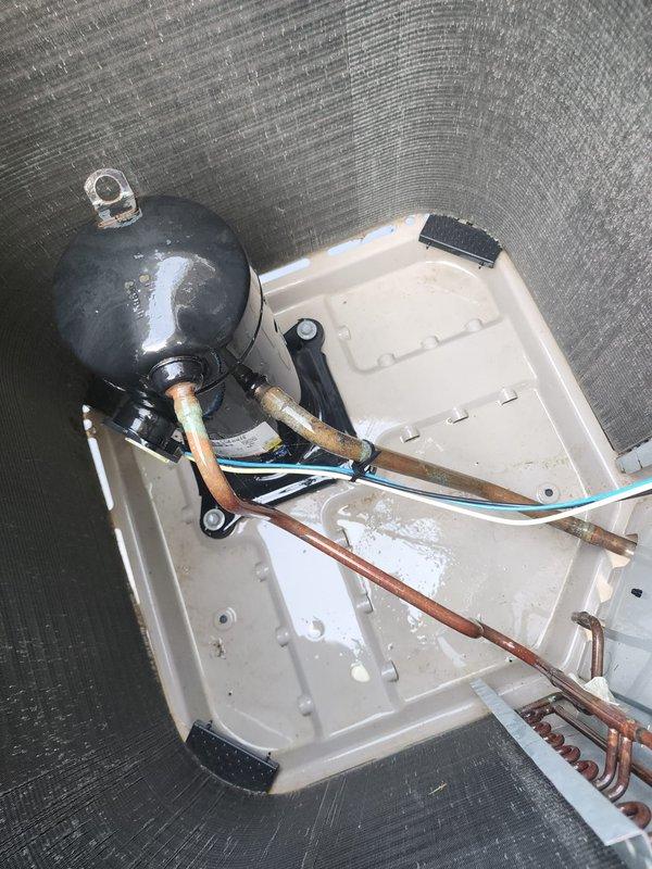 Completed comprehensive AC Maintenance 3-5 service on residential condensing unit. Performed detailed inspection of compressor assembly, copper refrigerant lines, electrical connections, and condensate management system. All components found in operational condition with normal wear patterns observed on copper tubing and condensate pan, confirming system is functioning properly for continued seasonal operation.