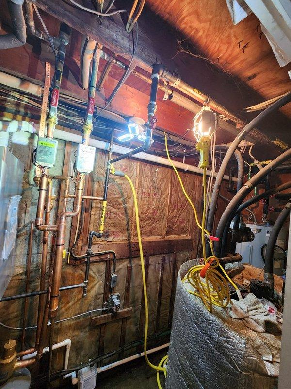 Completed installation of Alta boiler system in basement mechanical room with full hydronic piping connections and electrical integration. Installed two Honeywell T6 digital thermostats for multi-zone temperature control, with proper wiring and commissioning. All copper plumbing connections, control valves, and manifold assemblies were secured and tested for proper operation. System was energized, pressurized, and verified for safe operation with all safety controls functioning as designed.