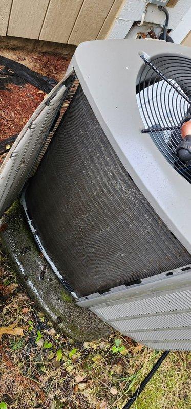Completed routine maintenance and tune-up on 3-year-old residential air conditioning system. Performed comprehensive inspection of outdoor condenser unit, including examination of condenser coils which showed accumulation of dirt, debris, and organic growth requiring attention. Inspected refrigerant line connections at evaporator coil assembly, verified proper mounting hardware and bracket integrity, and checked fan operation and protective grille condition to ensure optimal system performance for the cooling season.