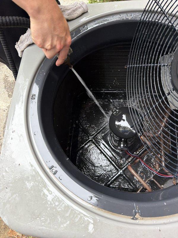 Completed comprehensive AC maintenance and tune-up on outdoor condensing unit. Performed system inspection with top panel removed to access internal components, checked compressor assembly and electrical connections, and verified proper fan operation. Unit reassembled and confirmed operational upon completion.