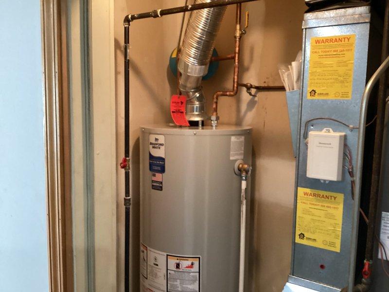 Successfully installed a 50-gallon residential tanked water heater in the utility room. Connected all copper supply piping, installed pressure relief valve with proper discharge piping, and attached flexible venting duct for proper exhaust. All connections were tested and verified operational with no leaks detected.