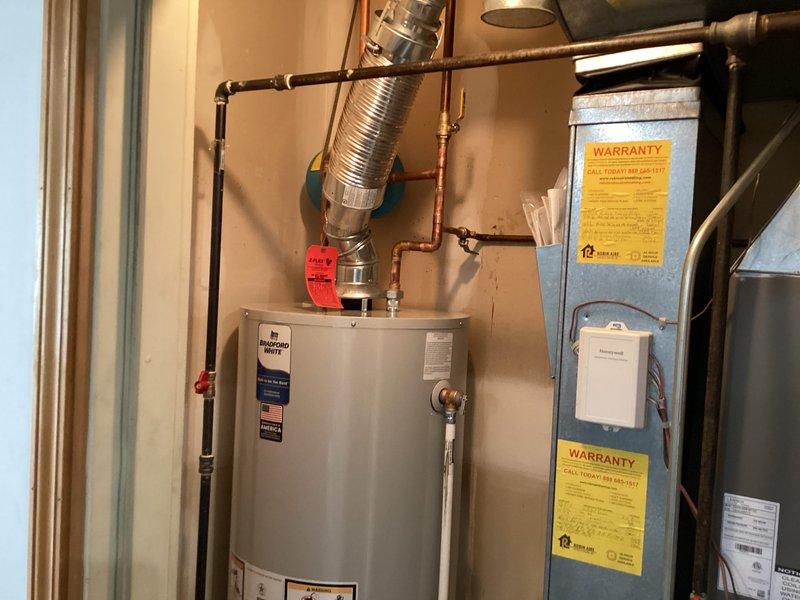Successfully installed a 50-gallon residential tanked water heater in the utility room. Connected all copper supply piping, installed pressure relief valve with proper discharge piping, and attached flexible venting duct for proper exhaust. All connections were tested and verified operational with no leaks detected.