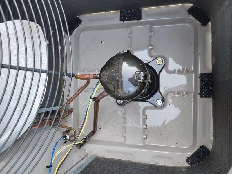Responded to service call for air conditioning system not cooling properly. Upon inspection, found low refrigerant charge in the system. Connected manifold gauges to measure operating pressures and confirmed undercharge condition. Located and repaired refrigerant leak, then evacuated the system and recharged to manufacturer specifications. Verified proper airflow across condenser coil and checked condensate drainage system for proper operation. System tested and confirmed cooling within normal parameters upon completion.