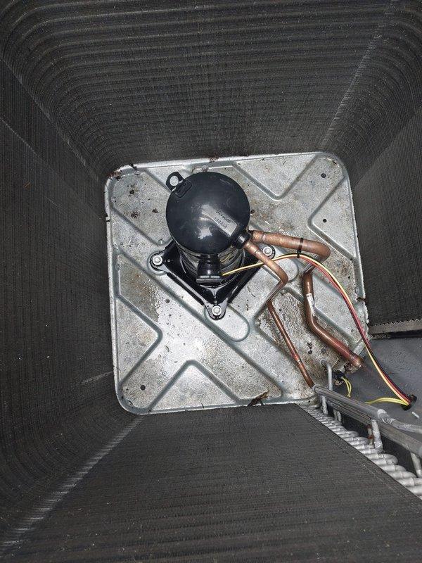 Responded to service call for water leak at evaporator coil. Upon arrival, verified thermostat operation and system cooling mode functionality. Inspected indoor air handler and located active water leak originating from evaporator coil assembly. Assessed compressor unit and refrigerant line connections for related issues. Documented system conditions including temperature readings and compressor mounting configuration. Addressed water leak at coil and restored system to proper operation.