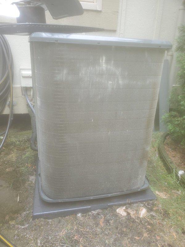 Completed routine AC maintenance on outdoor condensing unit. Inspected compressor, refrigerant lines, electrical connections, and capacitor. Cleaned condenser coil to remove dirt and debris accumulation from mesh screen and fins. All components operating within normal parameters upon completion of service.