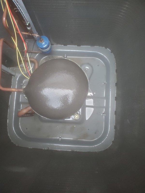 Completed routine AC maintenance on outdoor condensing unit. Inspected compressor, refrigerant lines, electrical connections, and capacitor. Cleaned condenser coil to remove dirt and debris accumulation from mesh screen and fins. All components operating within normal parameters upon completion of service.