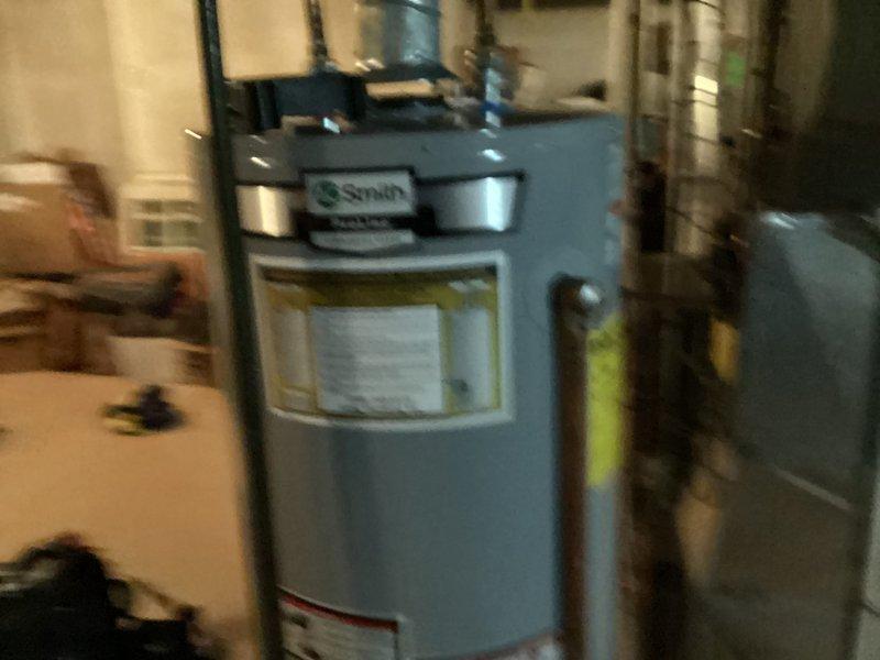 Completed installation of Lennox air conditioning system including outdoor condensing unit, indoor air handler, refrigerant line set, condensate drainage, and electrical connections. Installed new digital programmable thermostat and verified proper system operation with successful startup and temperature control functionality.