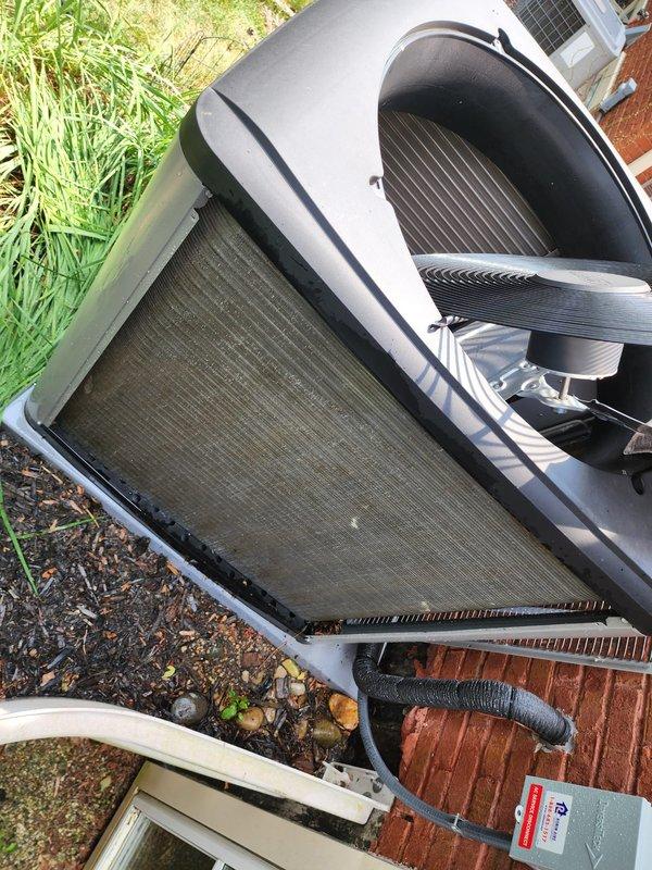 Completed routine cooling season maintenance inspection on residential outdoor AC unit. Performed visual assessment of condenser unit, verified proper placement and clearance, inspected heat exchanger coils and fins for damage or debris accumulation, and confirmed unit housing integrity with no visible defects noted.
