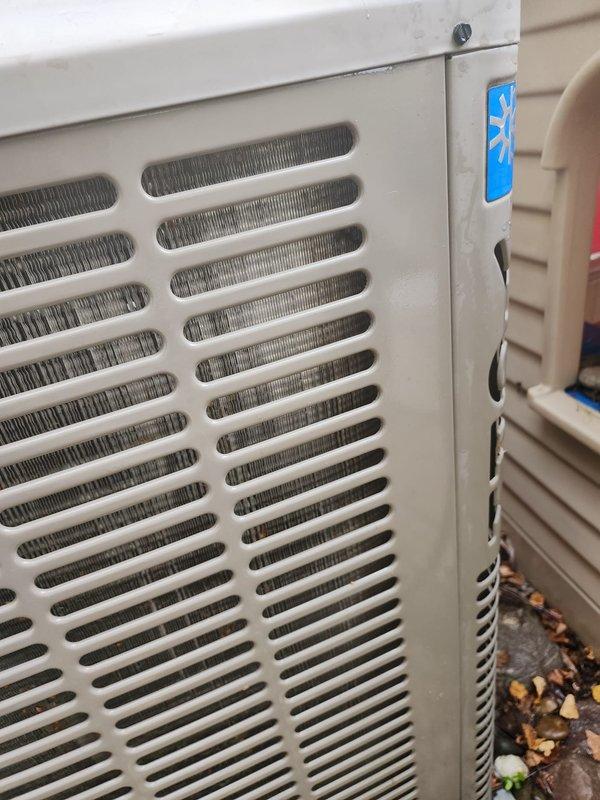 Completed routine AC maintenance on residential cooling system. Performed comprehensive inspection of outdoor condensing unit and indoor air handler components, including examination of evaporator coil fins, heat exchanger assembly, and structural mounting brackets. All internal components showed normal operational wear with minor dust accumulation typical for seasonal equipment. Verified proper airflow through louvered ventilation panels and confirmed cooling coils remain unobstructed. Unit exterior and protective grilles intact with no structural concerns noted. System operational and ready for continued service.
