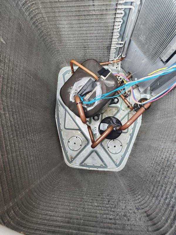 Completed preventative maintenance tune-up on 2-year-old residential air conditioning system with no reported issues. Performed comprehensive inspection of outdoor condenser unit and indoor evaporator coil assembly, documented frost accumulation on refrigerant lines indicating potential airflow restriction or refrigerant charge concern requiring monitoring. System operational at time of service with follow-up scheduled to verify performance.