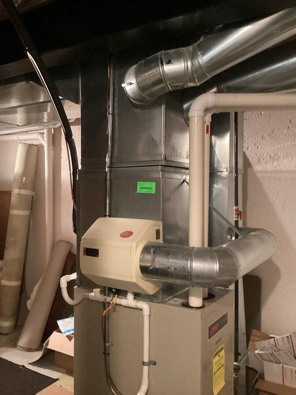 Completed furnace replacement estimate for two HVAC systems in residential basement installation. Evaluated existing beige furnace units with humidifiers and assessed ductwork configuration including metallic supply plenums and distribution systems. Provided multiple equipment options ranging from builder-grade to premium efficiency models for both systems to accommodate customer comparison with competing proposals.