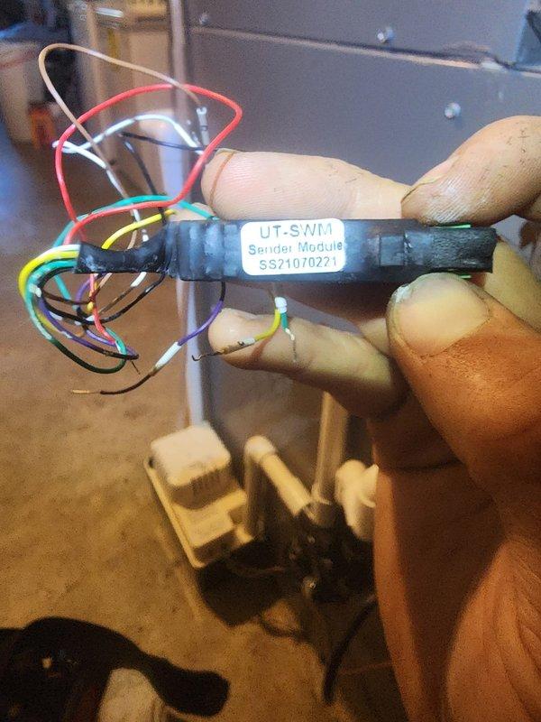 Responded to service call for Lennox central air conditioning system with complete loss of cooling function and flashing red indicator light. Diagnosed faulty sender module in the control system and replaced defective UT-SWM component. Verified proper thermostat wiring connections at terminal block, confirmed all wire terminations were secure, and tested system operation to ensure unit restored to normal cooling function with no error codes present.