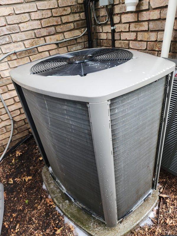 Completed routine AC tune-up on eleven-year-old air conditioning system located in walkout basement. Performed comprehensive maintenance including inspection of outdoor condenser unit, verified compressor operation, checked refrigerant lines and electrical connections, cleaned base pan area, and replaced two air filters as requested. System operating normally with no issues identified during inspection.