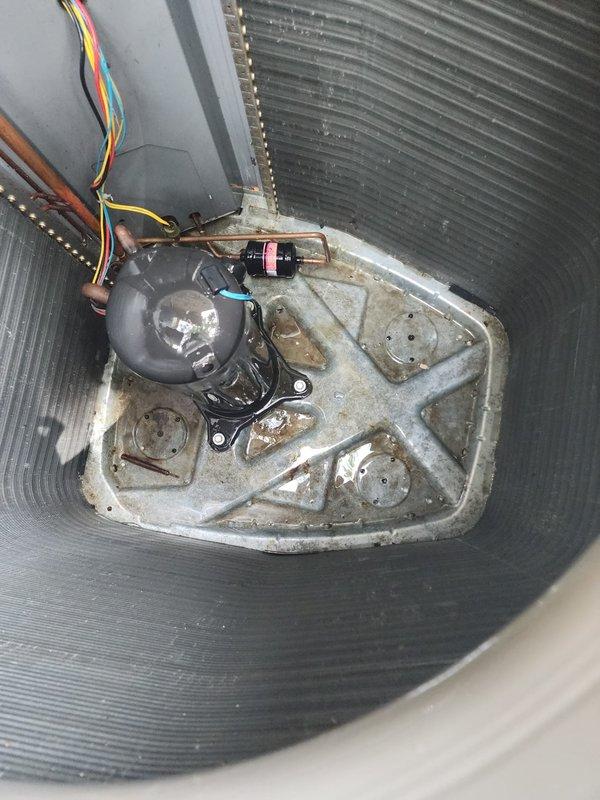 Completed routine AC tune-up on eleven-year-old air conditioning system located in walkout basement. Performed comprehensive maintenance including inspection of outdoor condenser unit, verified compressor operation, checked refrigerant lines and electrical connections, cleaned base pan area, and replaced two air filters as requested. System operating normally with no issues identified during inspection.