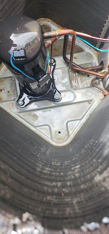 Completed scheduled preventive maintenance tune-up on residential cooling system. Inspected outdoor condensing unit and indoor evaporator coil assembly, verifying proper operation of all components including condensate pump and drain pan. Noted mineral deposits and dirt accumulation in drain pan and on condenser coils; system confirmed operational with no immediate service needs identified.