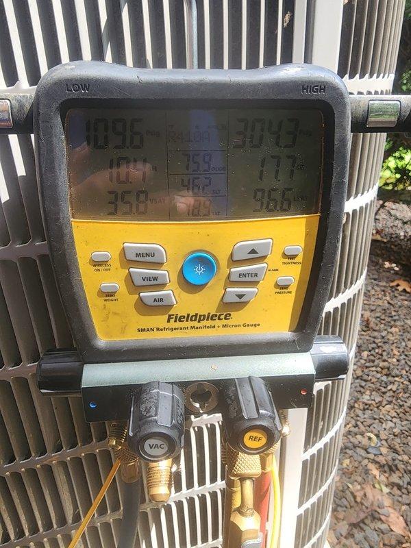 # HVAC Maintenance Visit Summary

Completed scheduled AC tune-up on outdoor condensing unit under prepaid maintenance plan. Performed comprehensive system diagnostics using Fieldpiece SMAN refrigerant manifold and micron gauge to verify refrigerant pressures, temperatures, and system performance across all zones. Inspected condenser coil fins, which were found in clean condition with proper airflow. Accessed internal compartment to examine base pan, capacitor, electrical connections, and copper refrigerant lines. All wiring connections secure with no signs of damage. Removed minor debris from internal base pan area. System operating within normal parameters with no deficiencies noted. Unit maintained and ready for continued service through 2026 contract period.