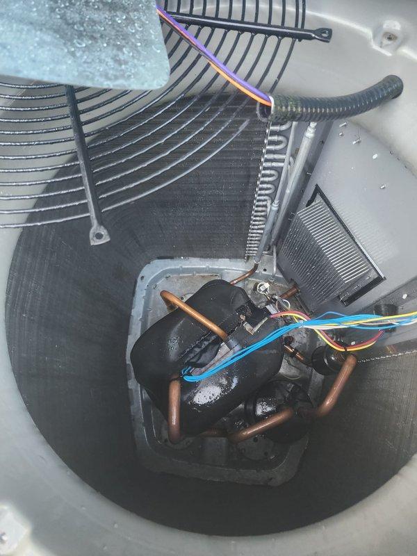 Completed scheduled AC maintenance on residential cooling system. Connected Fieldpiece diagnostic gauges to measure system pressures and temperatures, recording superheat and subcooling values to verify proper refrigerant charge and system performance. Inspected condensing unit components including dual fan assemblies, compressor, refrigerant lines, and electrical connections, noting normal condensation present on operating unit indicating proper functionality.