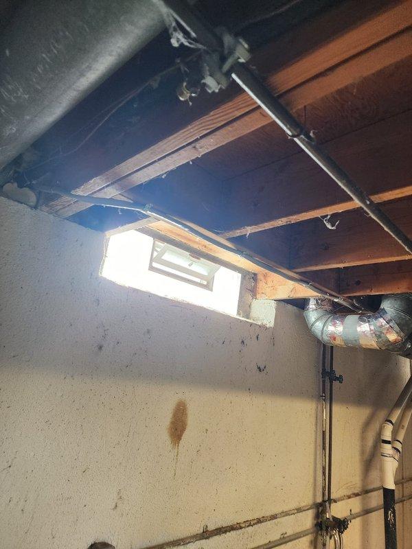 Conducted warranty inspection and documented electrical code violations on HVAC installation. Identified service disconnect clearance deficiency per 2015 MRC E3405.1, E3405.2 and 2023 NEC 110.26, as well as missing bushing or fitting where NMB cable enters flexible metal conduit per 2023 NEC 440.14. Photographed electrical panel, basement installation area, and code violation locations, then completed required follow-up documentation for correction.