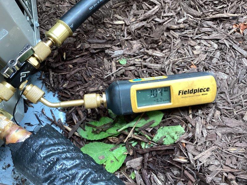 Replaced defective Duron condenser unit under warranty at residential property. Installed replacement condenser, connected refrigerant lines using brass service fittings, and performed system evacuation and charging procedures. Verified proper operation using Fieldpiece digital manifold gauges to confirm correct refrigerant pressures and temperatures. Tested fan motor operation and airflow through top-mounted circular fan assembly. Removed failed unit from site for return to shop per warranty protocol.