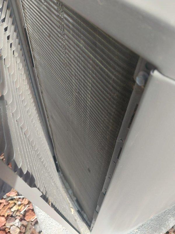 Completed comprehensive AC Maintenance 5-7 service on residential air conditioning system. Performed thorough inspection of outdoor condenser unit, including examination of heat exchanger coils which were found to be in clean condition with minimal debris accumulation. Inspected internal mechanical components including compressor housing and associated refrigerant line connections, noting normal operational wear patterns and minor dust accumulation on bracket assemblies.