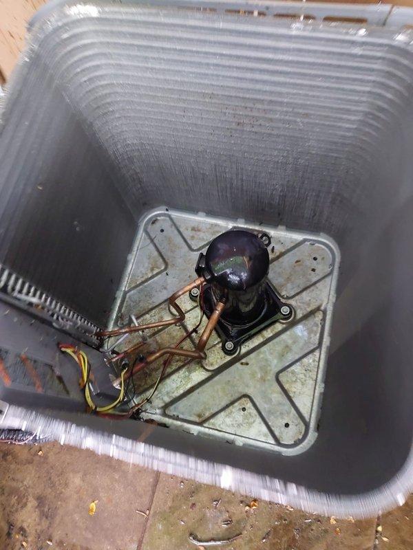Completed scheduled AC maintenance on residential heat pump system. Performed comprehensive inspection of outdoor condenser unit including cleaning of aluminum fin coils, verification of refrigerant line connections, and assessment of compressor operation. Unit found in good operating condition with proper installation on anti-vibration pad and secure electrical connections maintained.