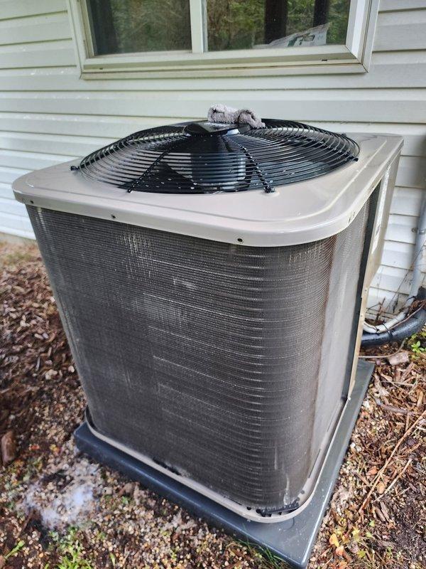 Completed scheduled AC tune-up maintenance on residential split system. Performed comprehensive inspection of outdoor condenser unit, verified operational status of all components, and checked refrigerant levels. Inspected indoor evaporator coil assembly, drain pan, and condensate pump system; noted standing water with normal sediment accumulation in drain pan and confirmed pump is functioning properly with all electrical connections secure.