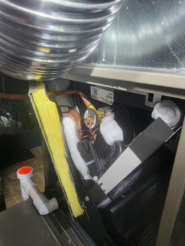 Responded to no-cooling complaint following previous day's coil replacement. Upon arrival, performed system diagnostics using manifold gauges to verify refrigerant pressures and temperatures. Inspection revealed system was operating but required verification of proper refrigerant charge and airflow through newly installed evaporator coil. Checked all refrigerant line connections at indoor unit for proper installation and verified condensate drain was clear and functioning. Measured operating pressures at outdoor condensing unit, confirmed compressor operation, and verified fan motor performance. System found to be operating within manufacturer specifications with adequate airflow at supply registers. Documented all readings with diagnostic equipment showing normal superheat and subcooling values, indicating proper refrigerant charge post-coil replacement.