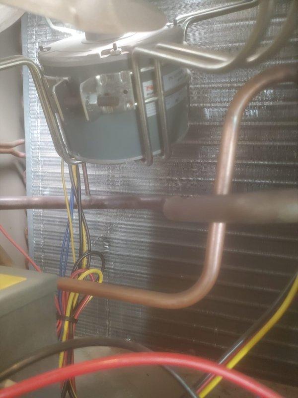 Completed preventive maintenance inspection on cooling system under Worry Free Service Agreement. Accessed and inspected internal components including blower assembly, evaporator coil, electrical connections, and refrigerant lines. Verified proper operation of fan motor, checked wiring connections for secure termination, and examined evaporator coil fins for cleanliness and airflow efficiency. All components found to be operating within normal parameters with no immediate service needs identified.