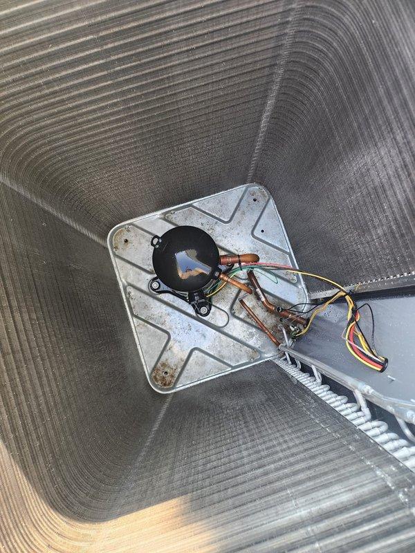 Completed comprehensive AC maintenance and tune-up on outdoor condensing unit. Performed standard seasonal maintenance including inspection of condenser coils, electrical connections, and internal blower assembly. All components found to be operating within normal parameters with routine dust accumulation noted and system confirmed operational.