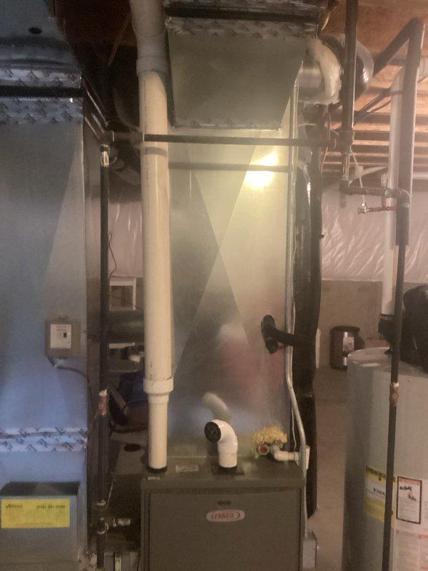 Conducted replacement estimate for residential HVAC system after customer declined diagnostic service due to failed AC compressor. Assessed existing Lennox furnace installation and associated ductwork, refrigerant lines, and ventilation components in basement mechanical room. Documented current system configuration including insulated ductwork, copper refrigerant piping, PVC exhaust venting, and overall equipment layout to prepare comprehensive replacement quote for new air conditioning system.