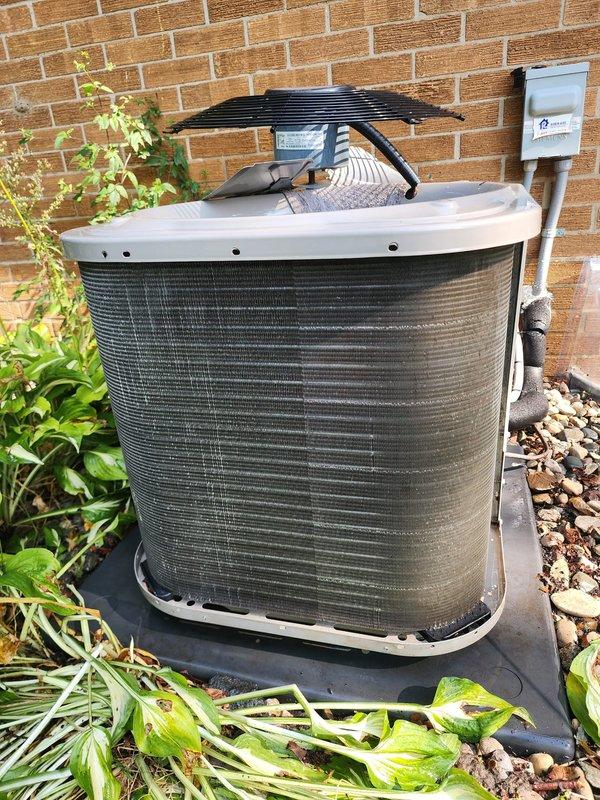 Completed routine preventive maintenance on residential air conditioning system. Inspected indoor air handler components including evaporator coil, condensate drain assembly, refrigerant lines, and accumulator, confirming proper operation and no visible leaks. Performed exterior inspection of condenser unit, verified electrical disconnect functionality, and cleared vegetation from around unit to ensure adequate airflow and system efficiency.