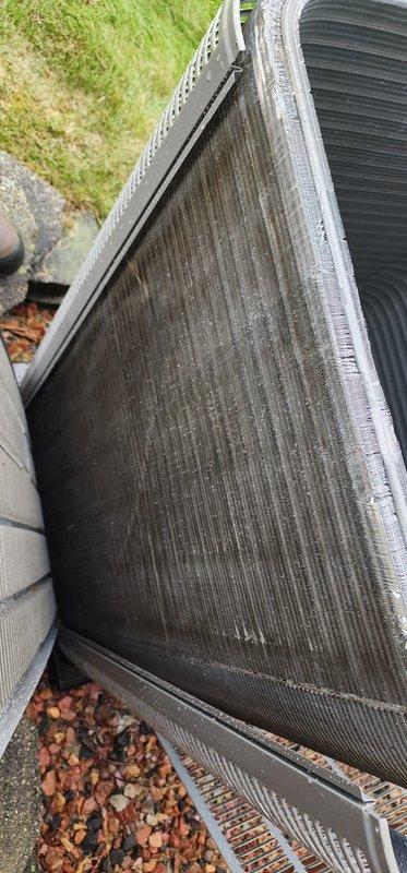 Completed scheduled AC maintenance on outdoor condensing unit. Inspected condenser coil which showed moderate dirt and debris accumulation between fins, cleaned compressor assembly and copper refrigerant lines, and applied appropriate maintenance treatment to compressor components to ensure optimal system performance and efficiency.