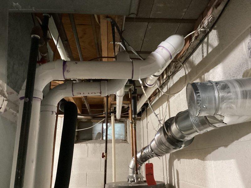 Completed full HVAC system installation including Lennox furnace, air conditioner, and humidifier. All equipment installed to manufacturer specifications with proper venting, drainage, electrical connections, and ductwork integration. PVC condensate drain lines installed with check valve assembly, flexible metallic ductwork routed and secured, and all electrical disconnects properly mounted and wired. System tested and operational.