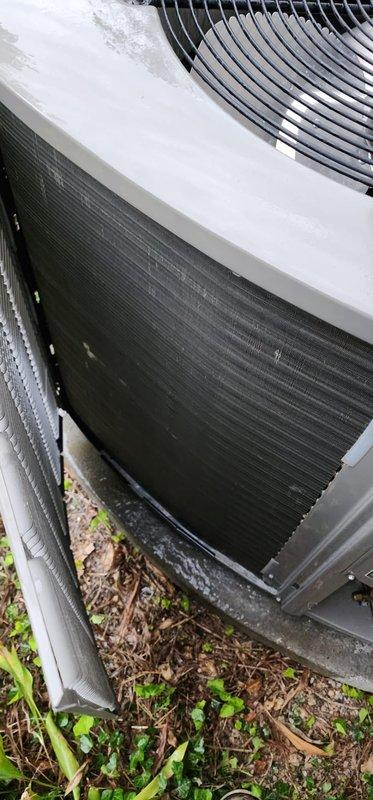 Completed preventive maintenance on residential split-system air conditioning unit. Performed comprehensive inspection of outdoor condenser unit including visual examination of cabinet condition, refrigerant line connections, electrical conduit, and mounting pad stability. Verified proper airflow through condenser coil fins and fan grille operation, confirmed unit accessibility for service, and documented equipment condition through photographic records.