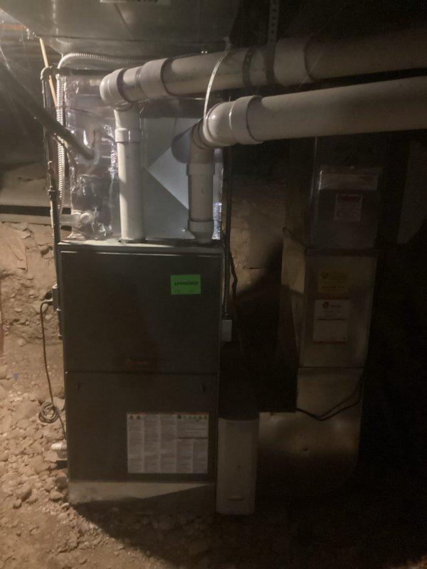 Completed comprehensive HVAC replacement estimate for residential air conditioning system. Documented existing furnace installation in basement utility area, including current configuration of PVC venting, flexible ductwork connections, and equipment placement alongside water heater. Assessed crawl space installation conditions, structural considerations, and existing infrastructure to provide accurate replacement recommendations for new AC system integration with current heating equipment.